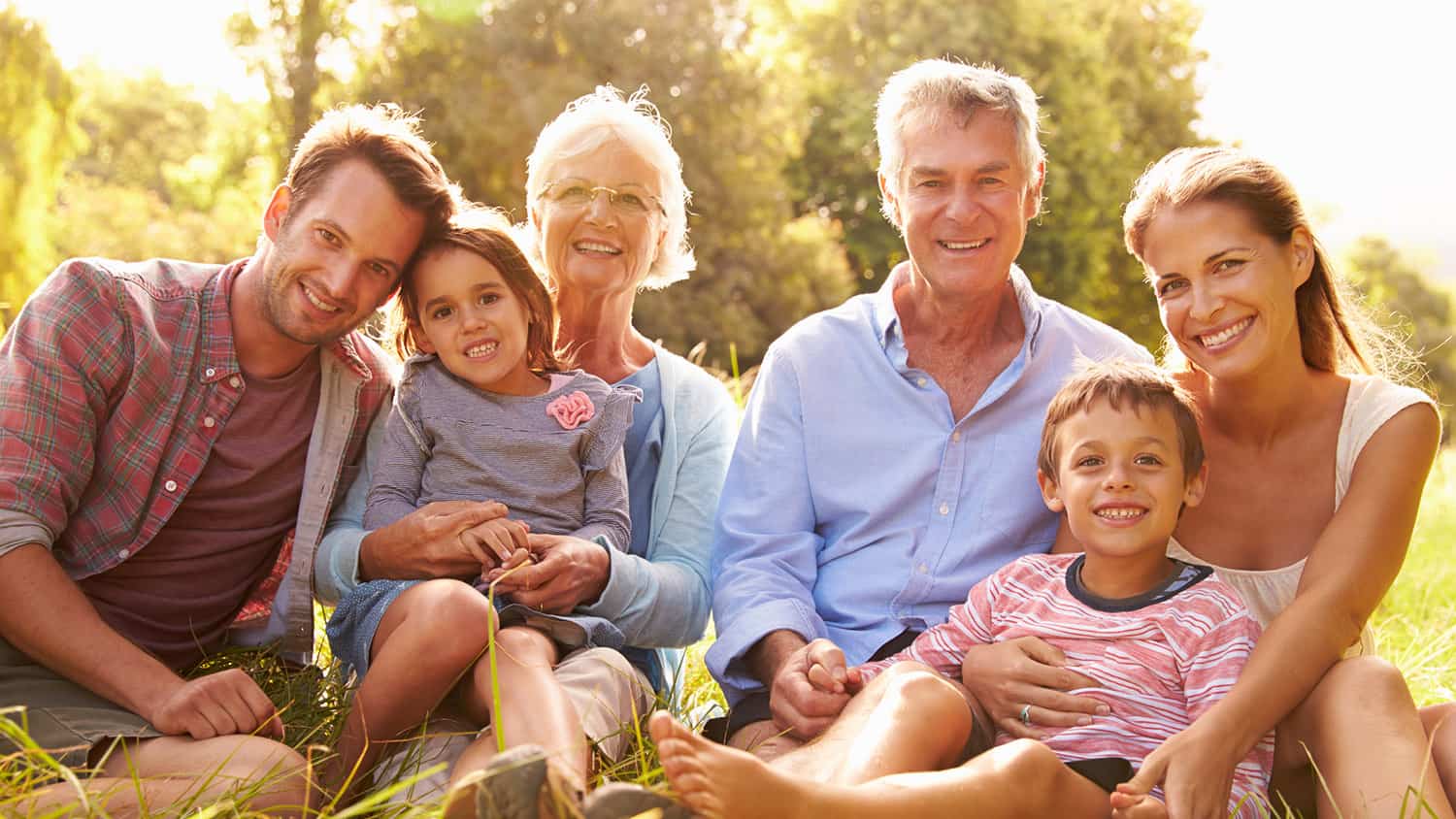 Three generations of a family gathered together outdoors